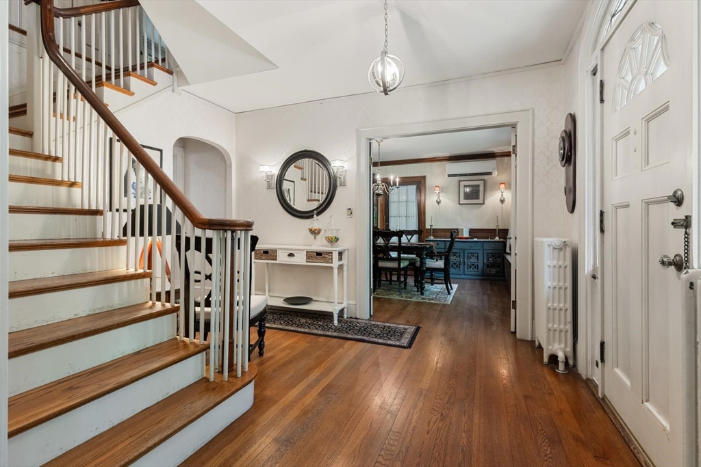 114 South Border Road Medford, MA 02155 - Photo 5 of 36 a living room with furniture and a clock