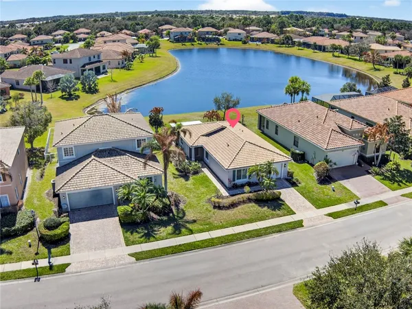 an aerial view of a house with a garden and plants