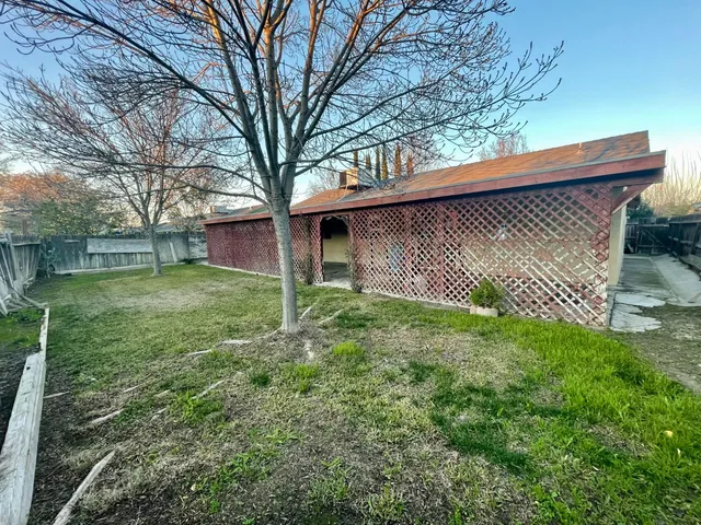 a backyard of a house with lots of green space