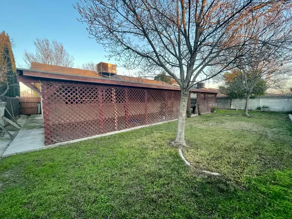 a backyard of a house with lots of green space