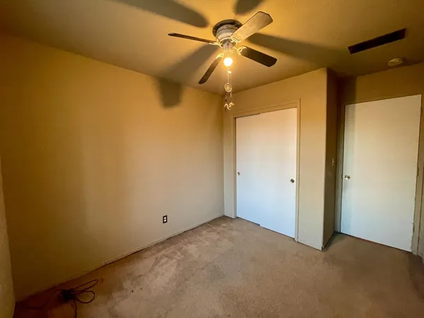 a view of a big room with carpet