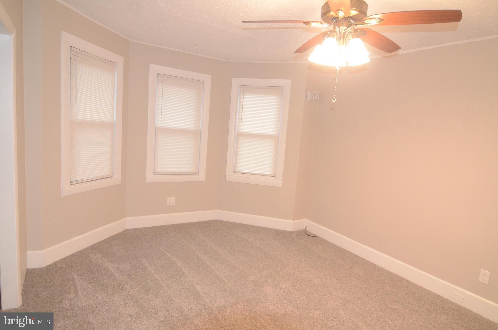 219 9th Avenue, Unit B Haddon Heights, NJ 08035 - Photo 13 of 22 an empty room with windows and fan