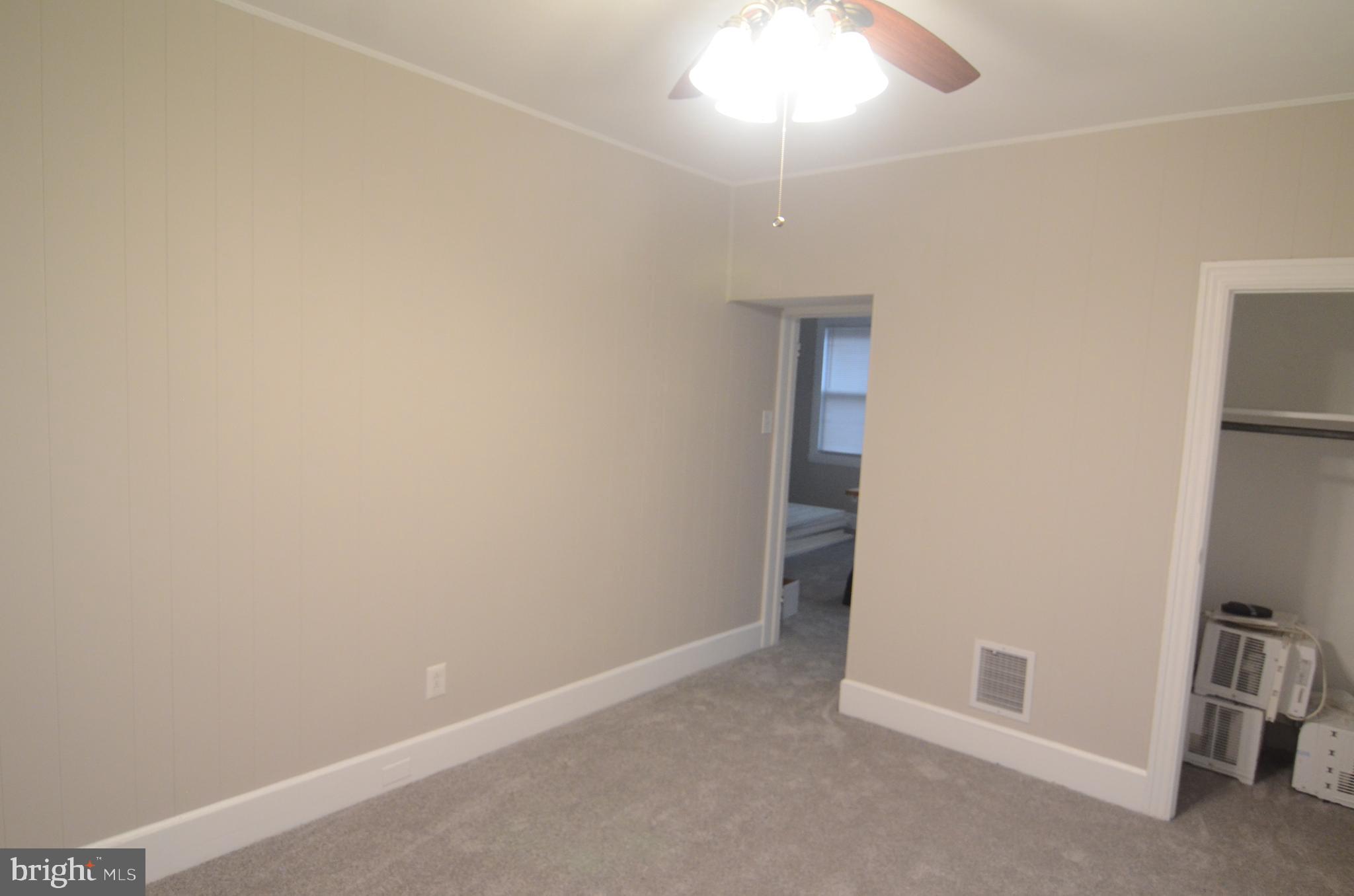 219 9th Avenue, Unit B Haddon Heights, NJ 08035 - Photo 15 of 22 an empty room with a empty space and a ceiling fan