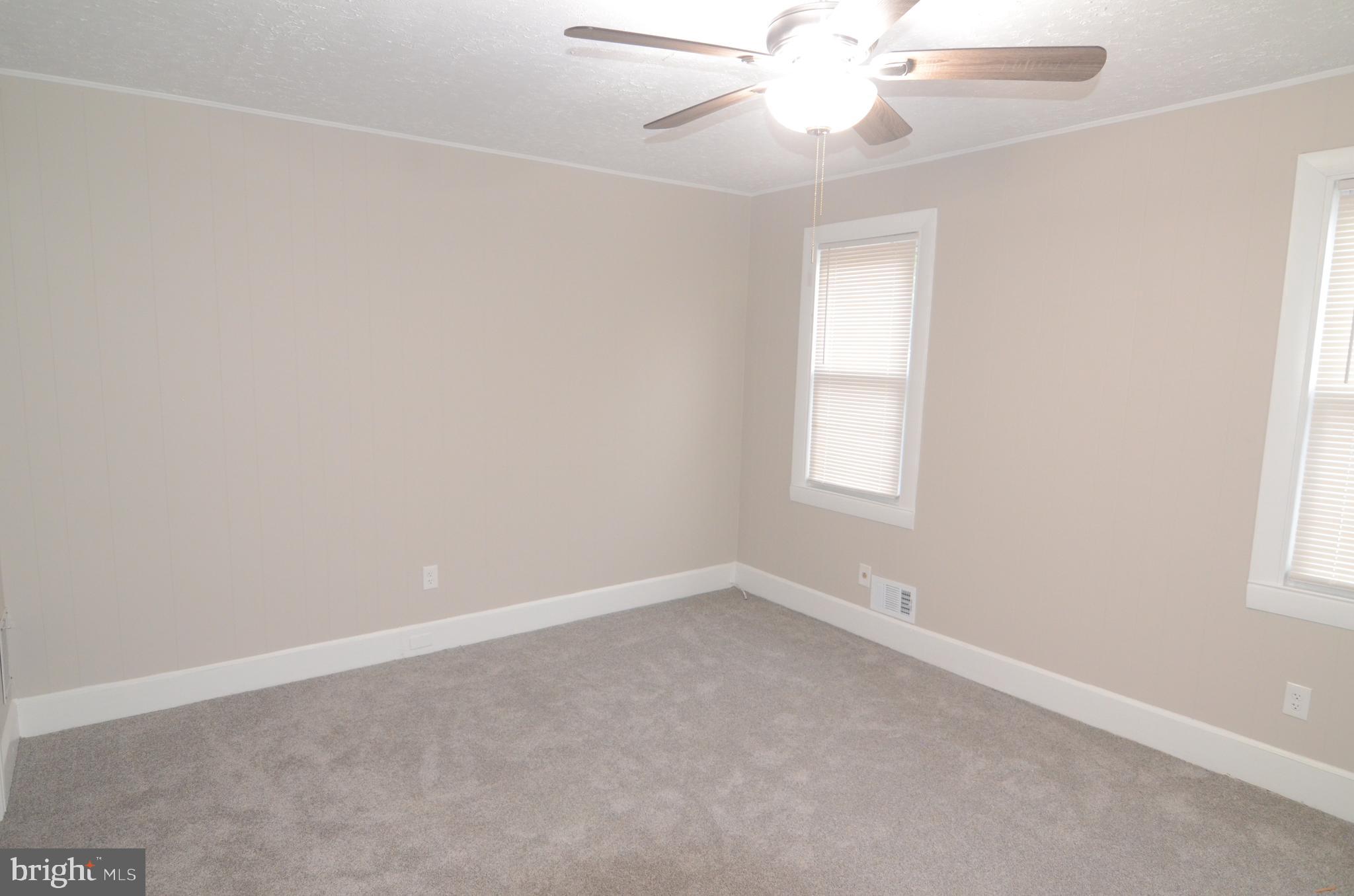 219 9th Avenue, Unit B Haddon Heights, NJ 08035 - Photo 18 of 22 an empty room with a window and a fan