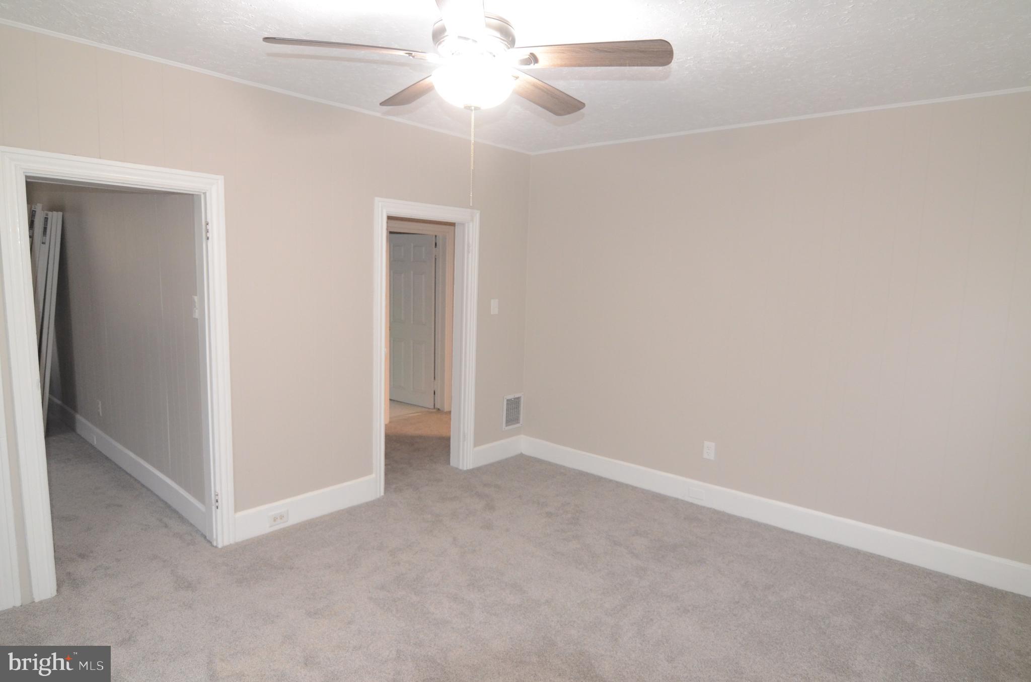 219 9th Avenue, Unit B Haddon Heights, NJ 08035 - Photo 19 of 22 an empty room with a fan & a ceiling fan