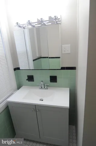 a view of walk in closet with clothes