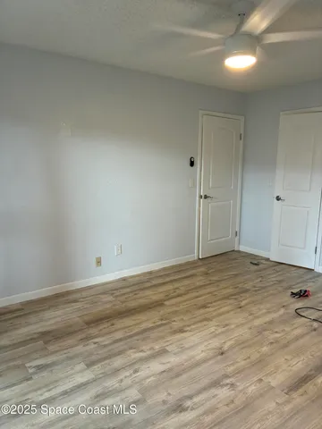 a view of a patio with table and chairs near a yard