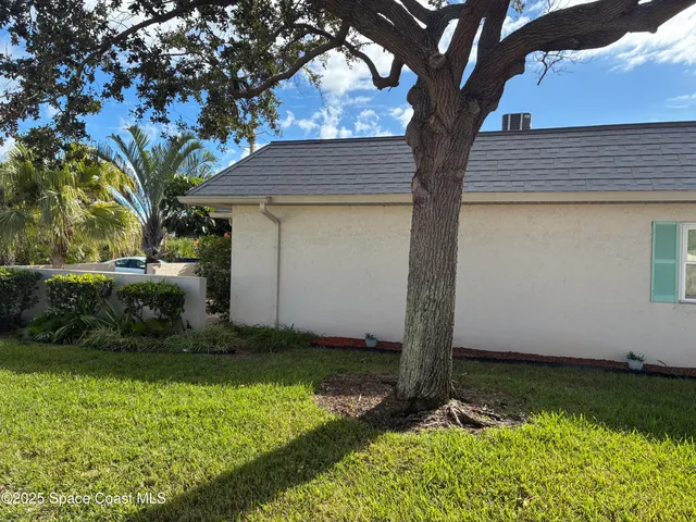 a kitchen with granite countertop a sink a stove a microwave and cabinets
