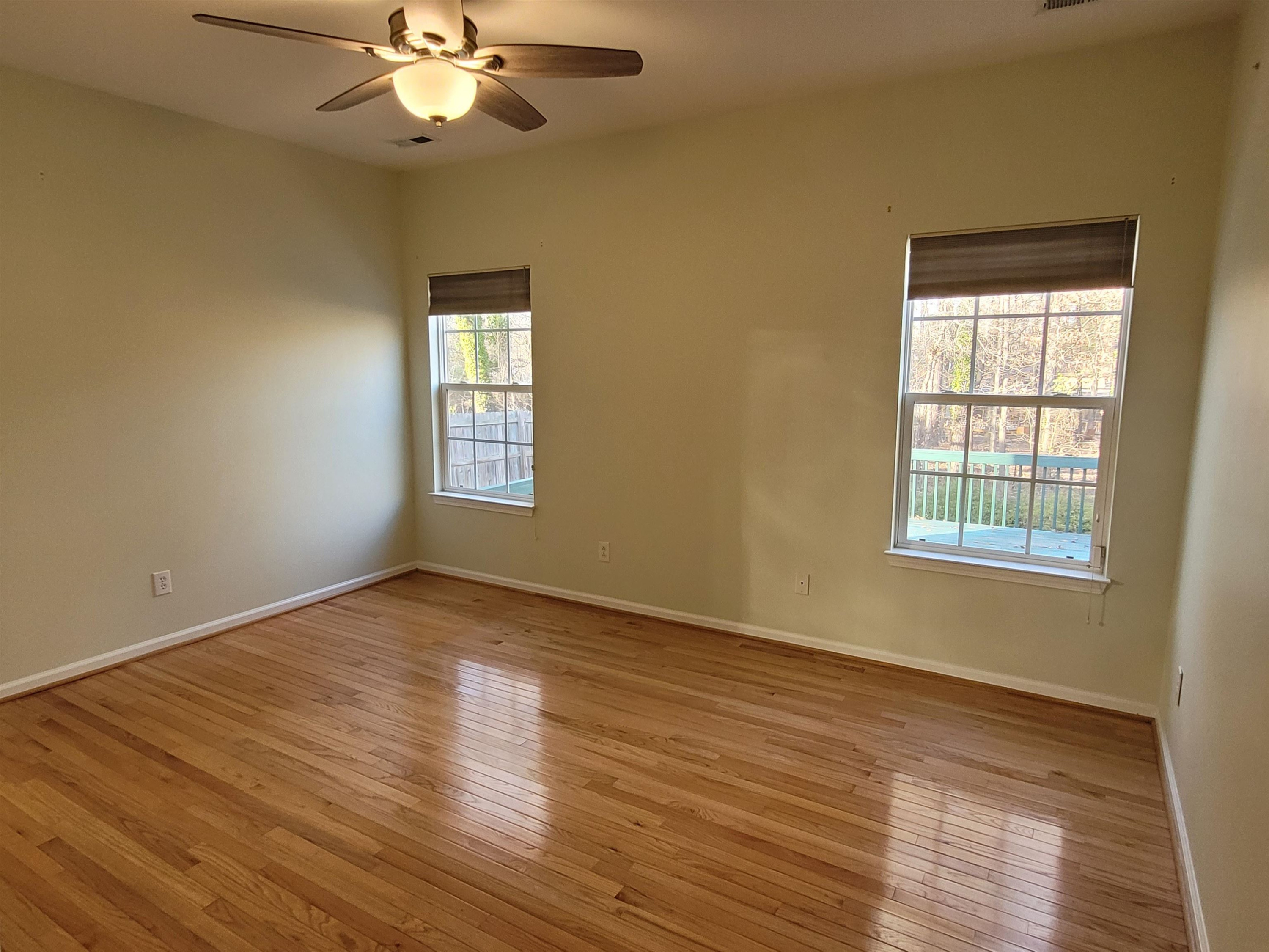 7 Calaveras Court Durham, NC 27713 - Photo 13 of 30 a view of an empty room with wooden floor and a window