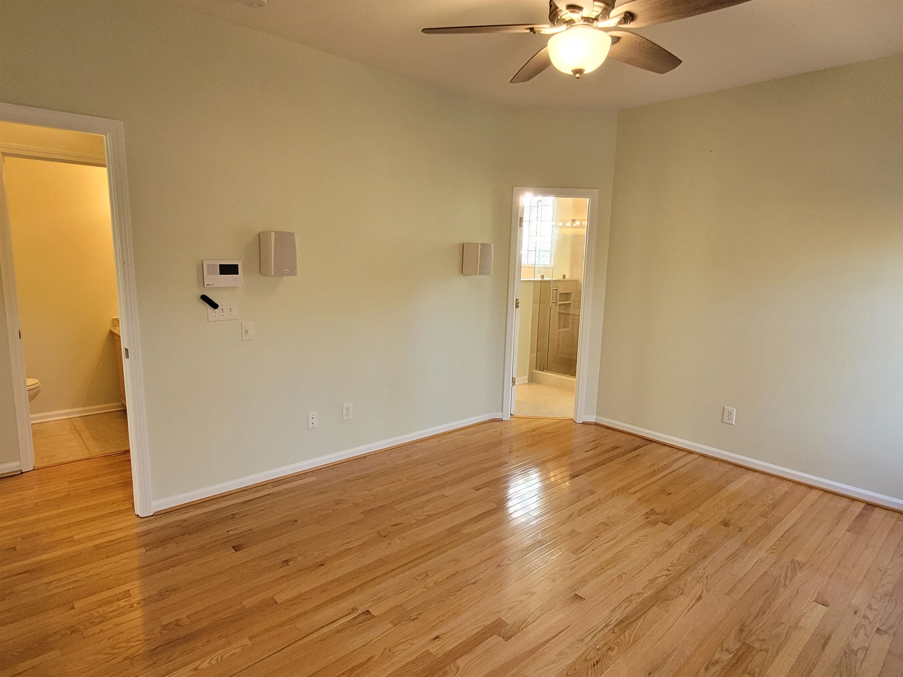7 Calaveras Court Durham, NC 27713 - Photo 14 of 30 a view of an empty room with wooden floor and a window