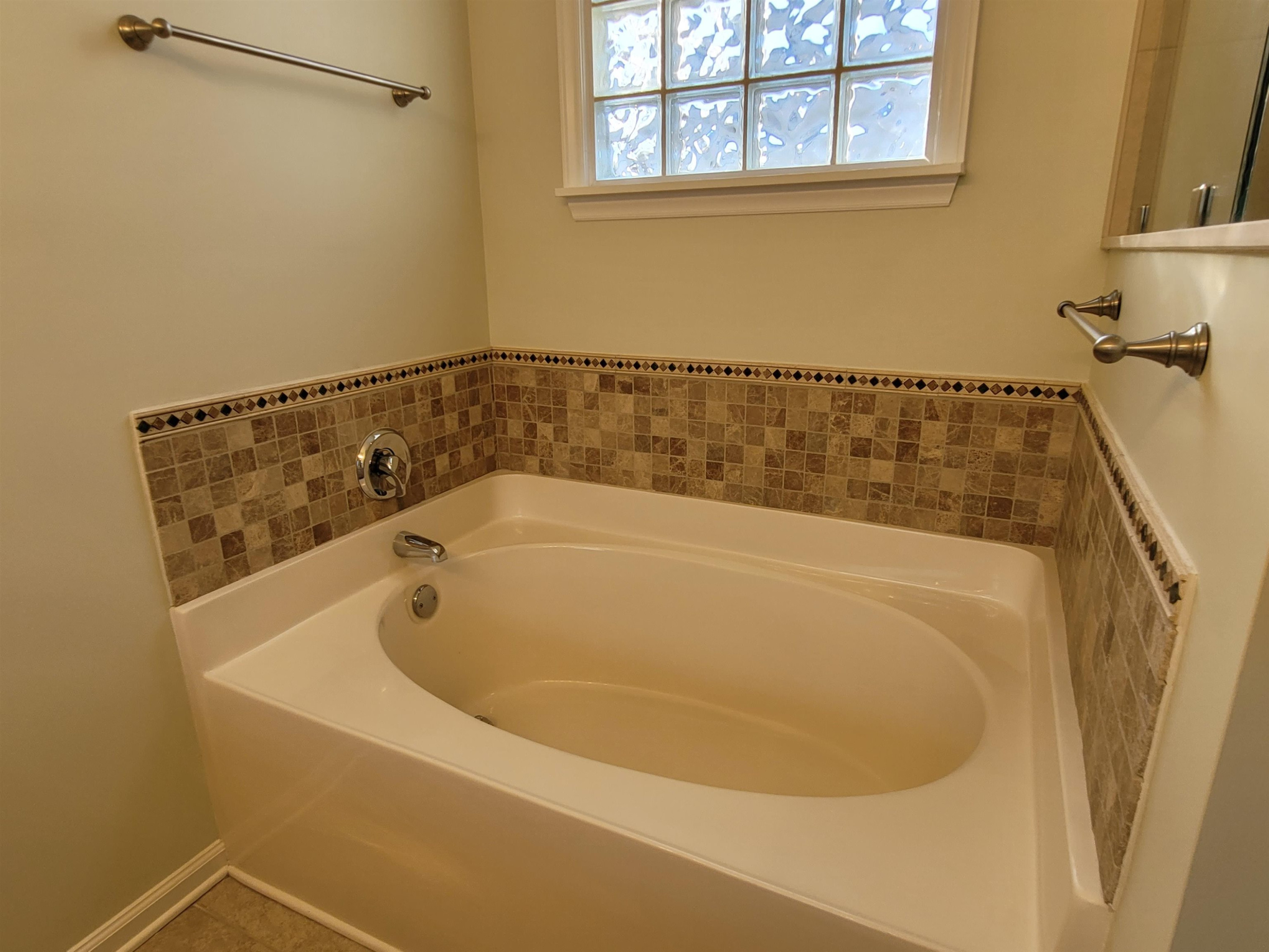 7 Calaveras Court Durham, NC 27713 - Photo 16 of 30 a bath tub sitting next to a window