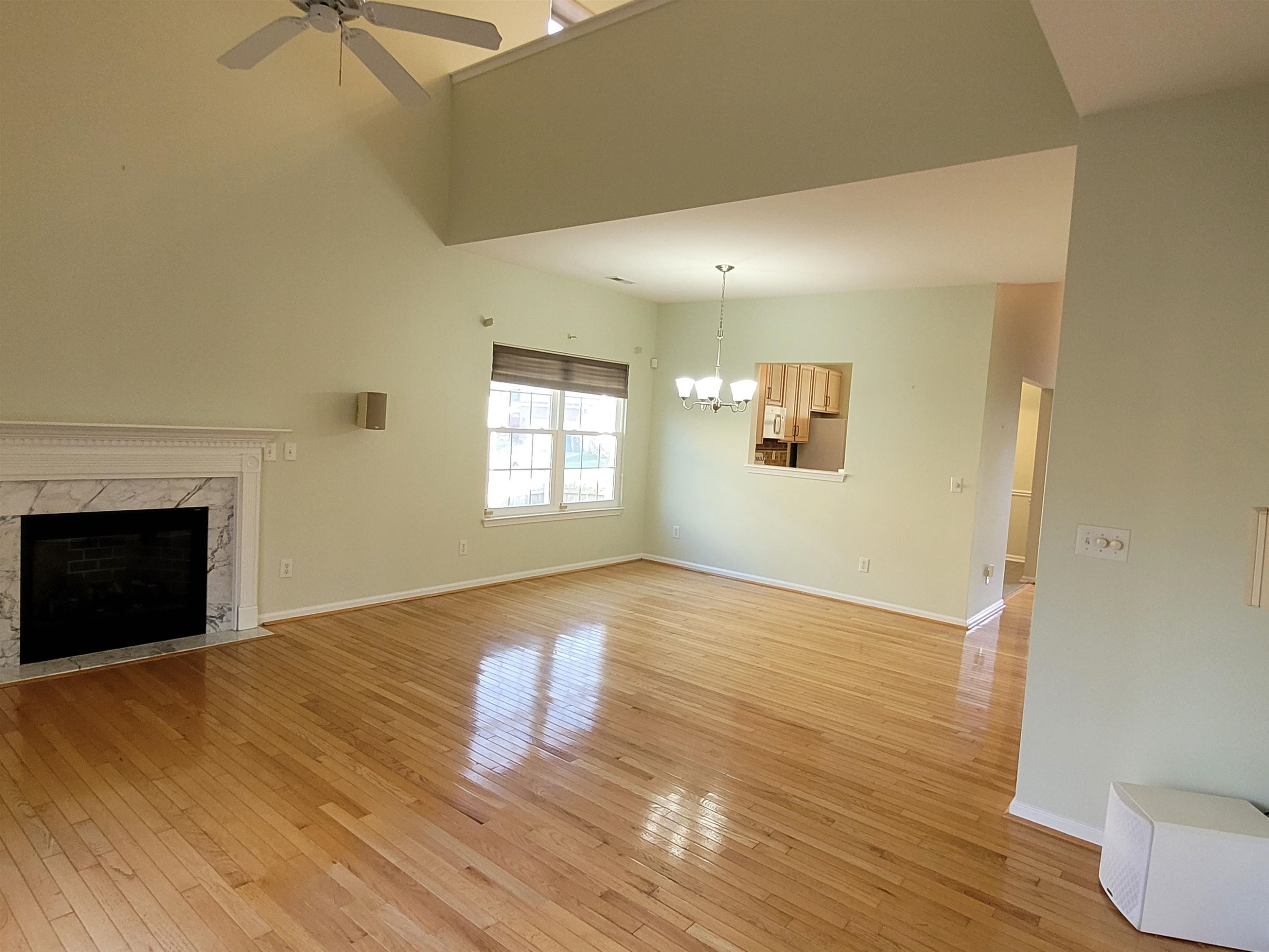 7 Calaveras Court Durham, NC 27713 - Photo 8 of 30 a view of an empty room with wooden floor and a window