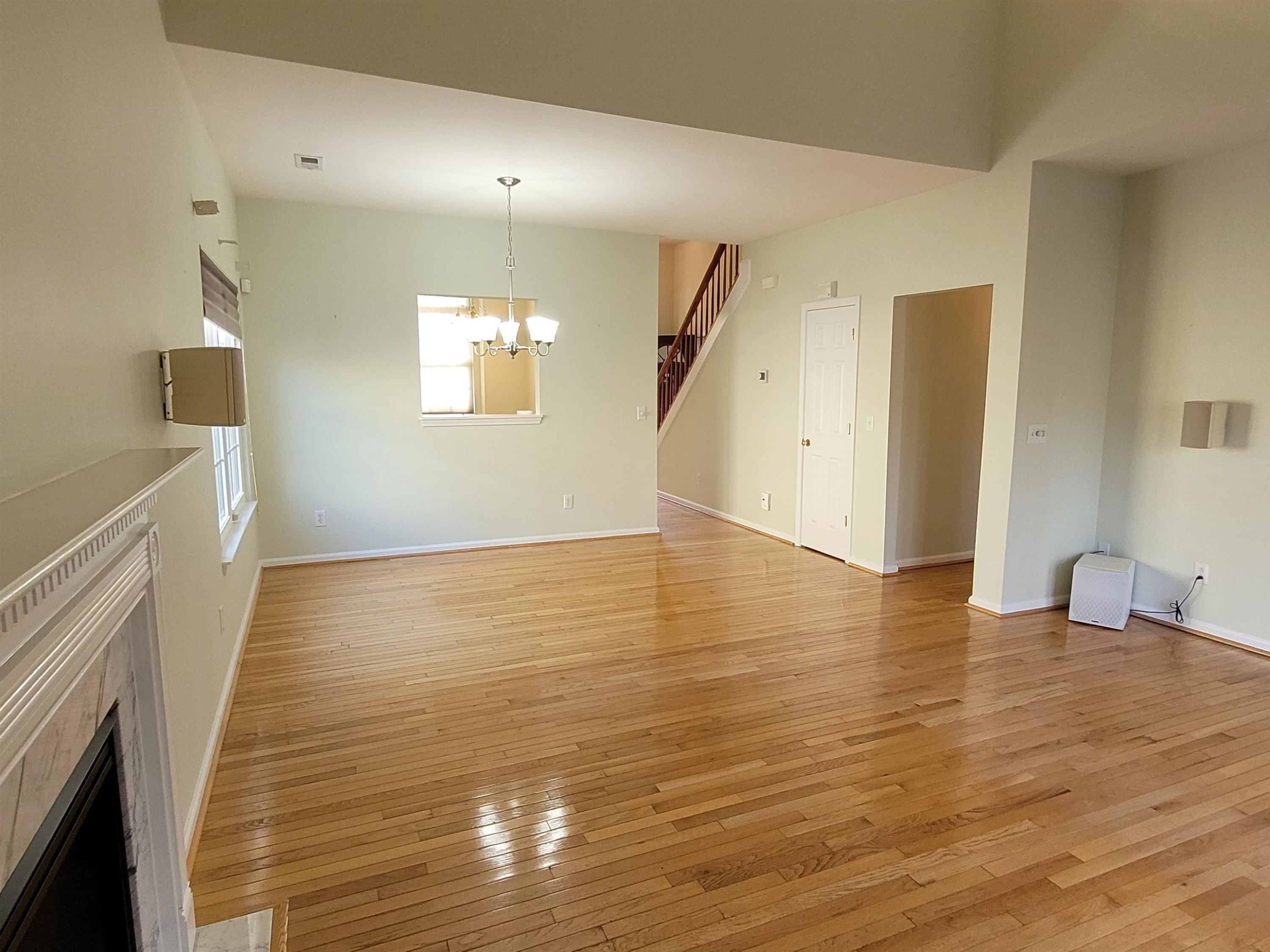 7 Calaveras Court Durham, NC 27713 - Photo 9 of 30 a view of an empty room with wooden floor and a window