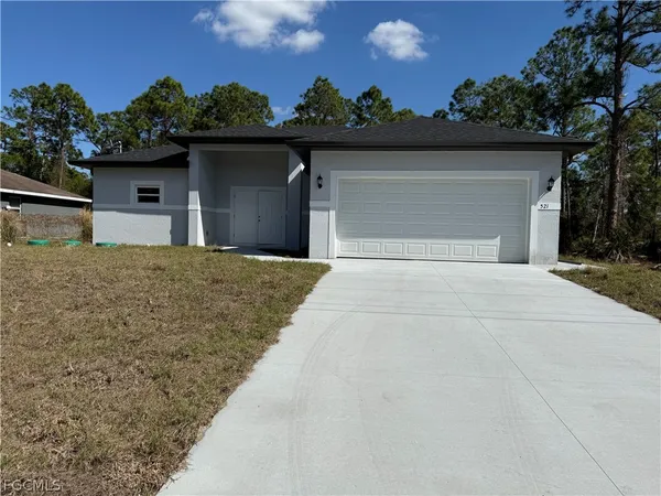 front view of a house with a yard