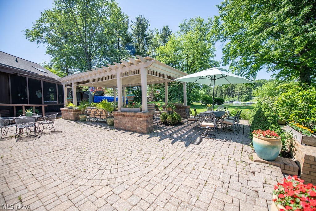 2009 Lakewood Road Southwest Sherrodsville, OH 44675 - Photo 6 of 47 Paved patio featuring lake views