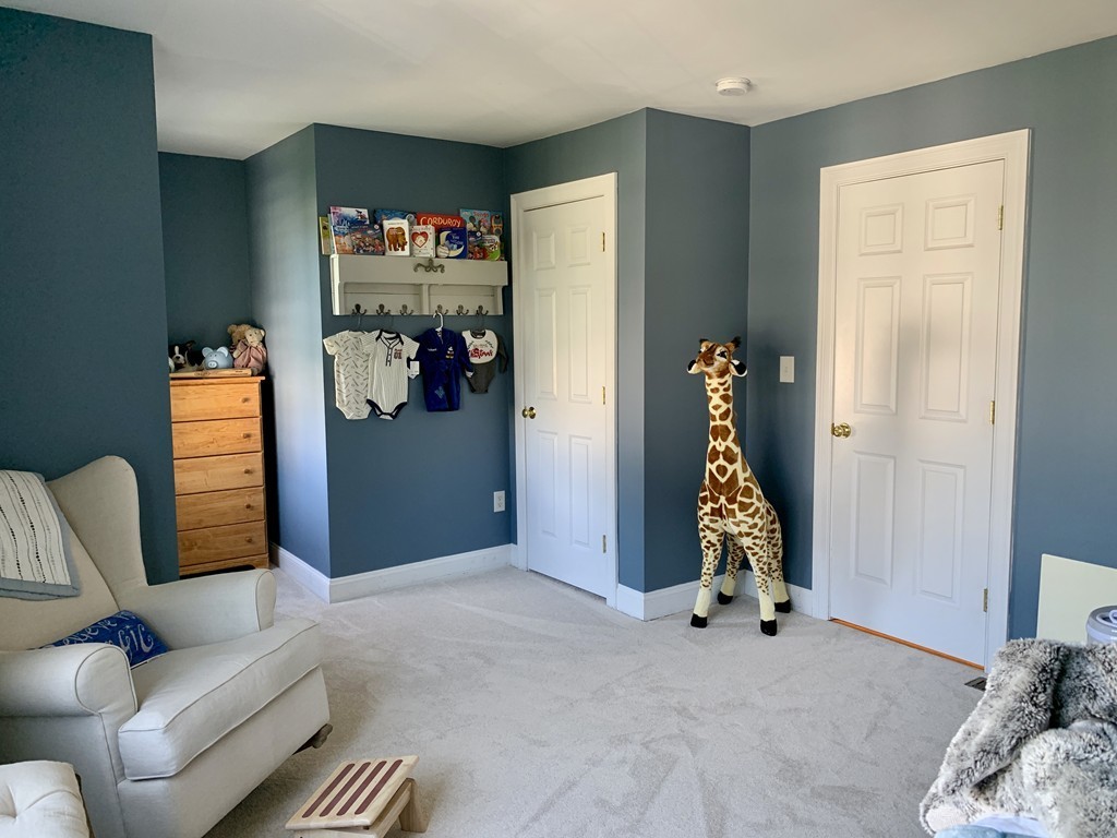 130 Turnpike Road, Unit 13 Chelmsford, MA 01824 - Photo 17 of 35 a view of livingroom with furniture and closet