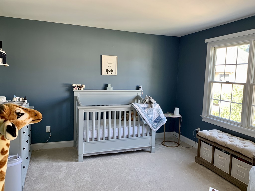 130 Turnpike Road, Unit 13 Chelmsford, MA 01824 - Photo 18 of 35 a bedroom with a bed and a window