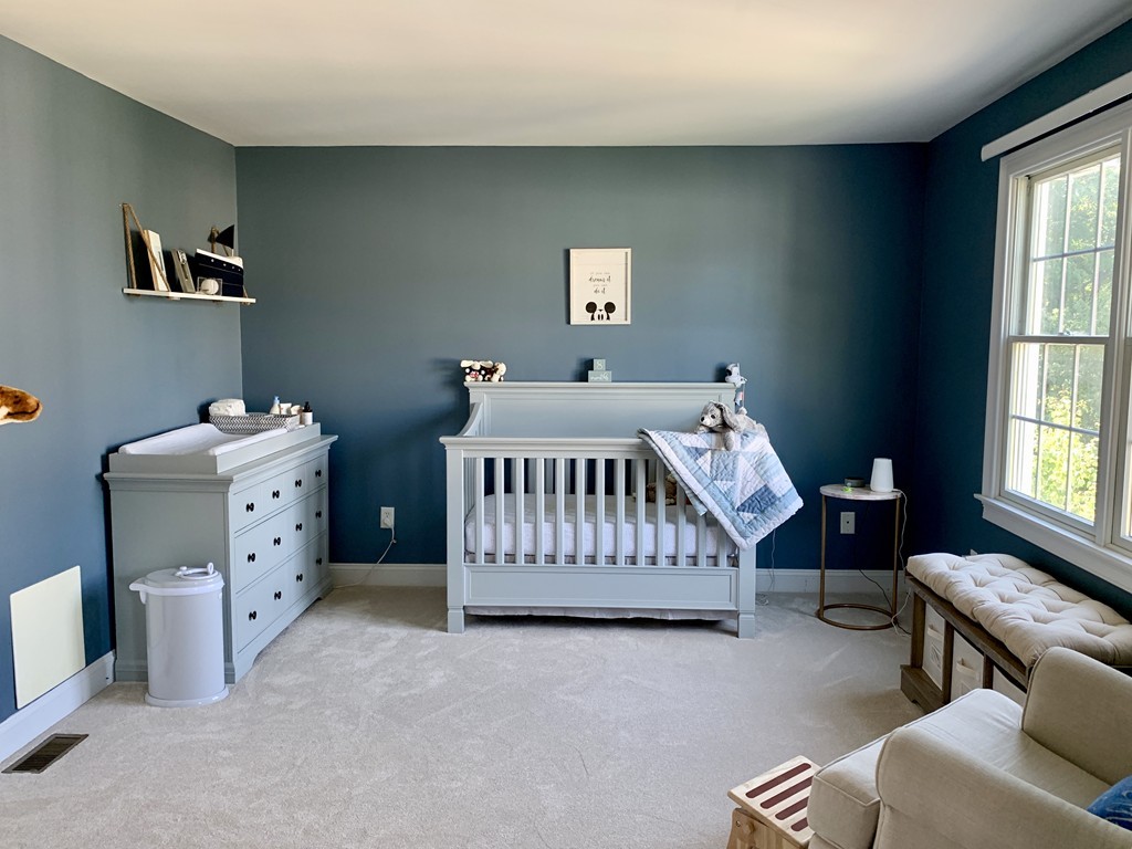 130 Turnpike Road, Unit 13 Chelmsford, MA 01824 - Photo 19 of 35 a bedroom with a bed and a window