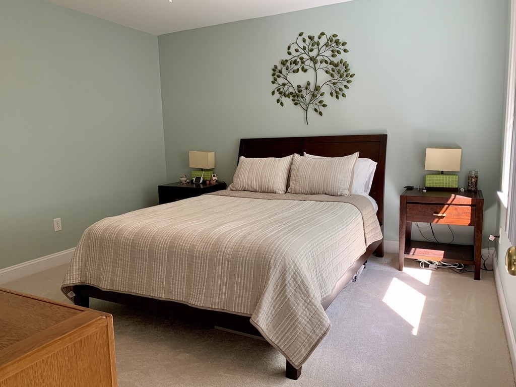 130 Turnpike Road, Unit 13 Chelmsford, MA 01824 - Photo 23 of 35 a bedroom with a bed and a couch