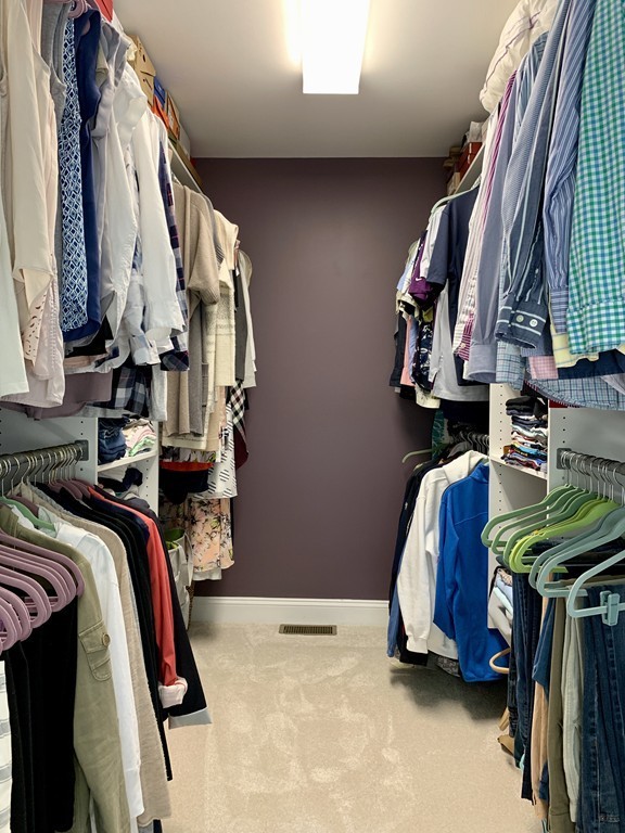 130 Turnpike Road, Unit 13 Chelmsford, MA 01824 - Photo 24 of 35 a view of walk in closet with clothes and shoes