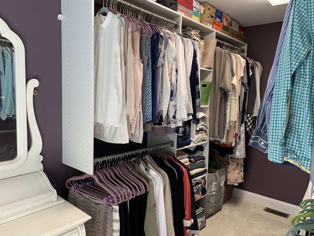 130 Turnpike Road, Unit 13 Chelmsford, MA 01824 - Photo 25 of 35 a view of walk in closet with clothes and shoes