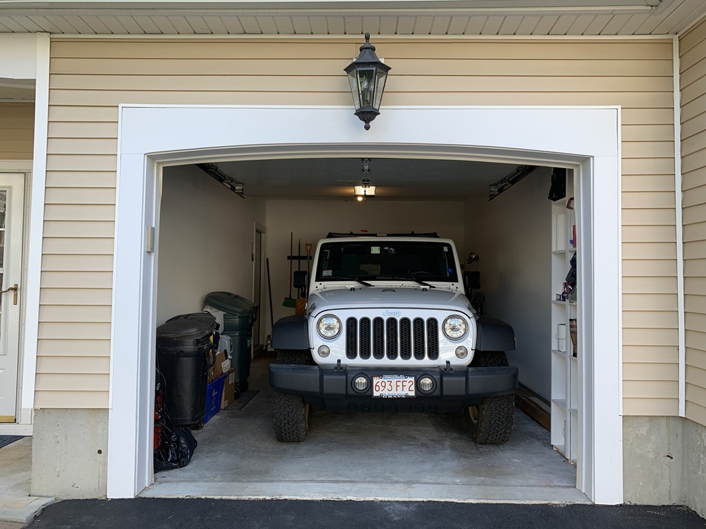 130 Turnpike Road, Unit 13 Chelmsford, MA 01824 - Photo 30 of 35 a view of bedroom with a car parked in it