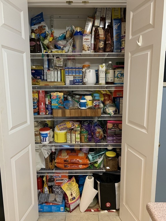 130 Turnpike Road, Unit 13 Chelmsford, MA 01824 - Photo 6 of 35 a room with wine cabinets