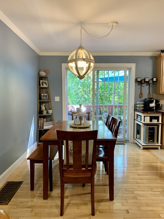 130 Turnpike Road, Unit 13 Chelmsford, MA 01824 - Photo 7 of 35 a view of a dining room with furniture window and outside view