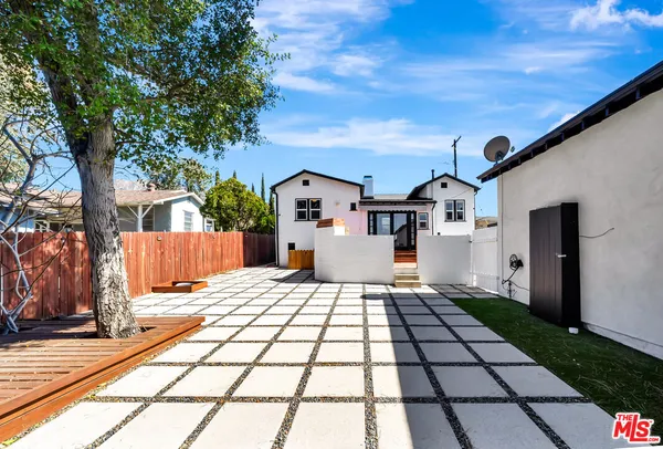 a view of balcony with wooden floor and fence