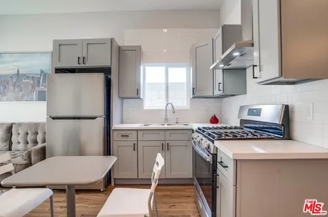 a bedroom with a bed and a table in it
