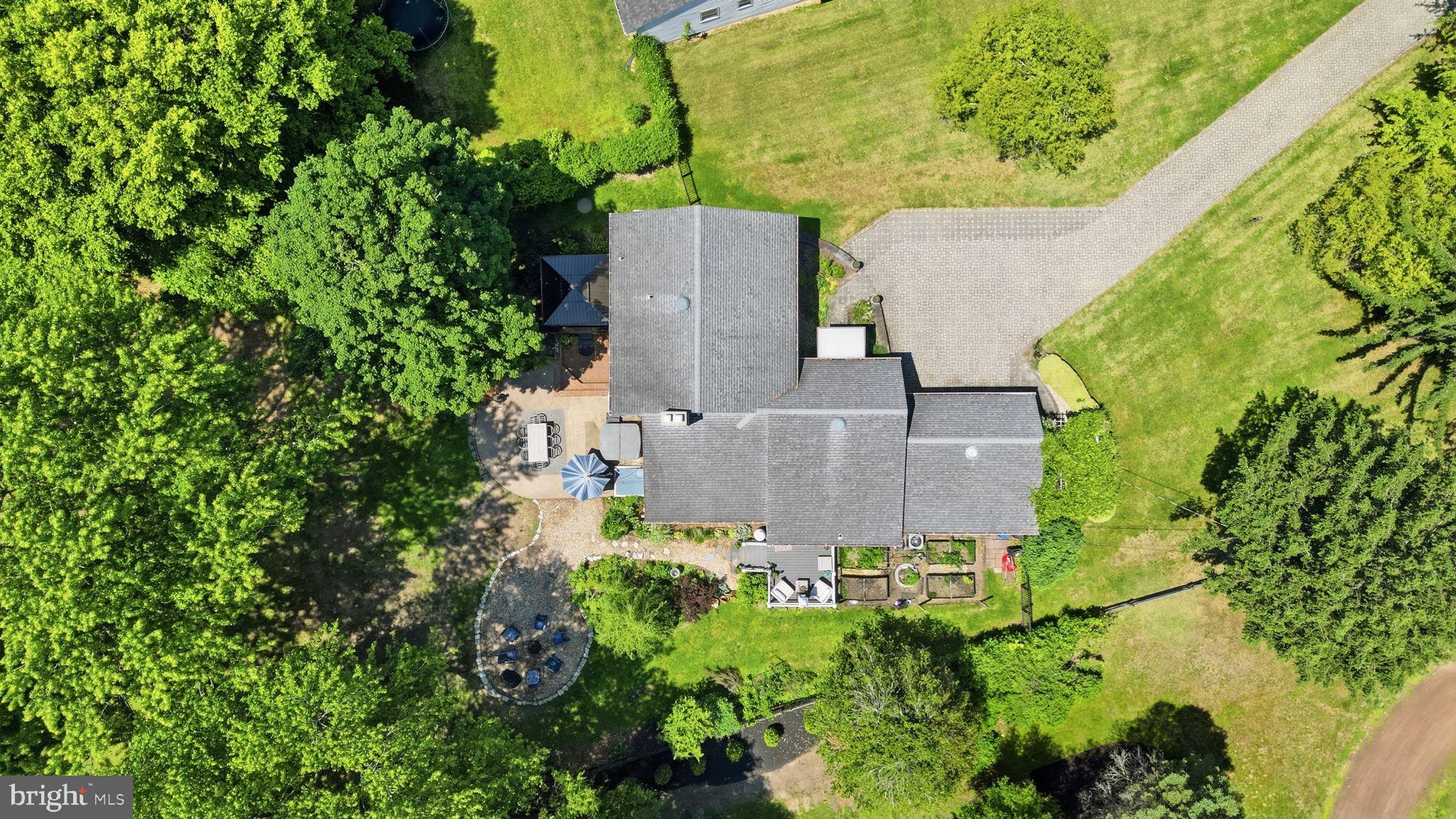 621 River Road Yardley, PA 19067 - Photo 72 of 75 an aerial view of a house with a yard and garden space