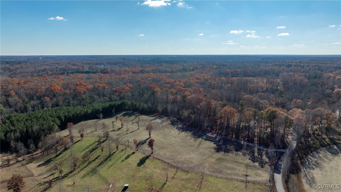 Birds eye view of property featuring a rural view