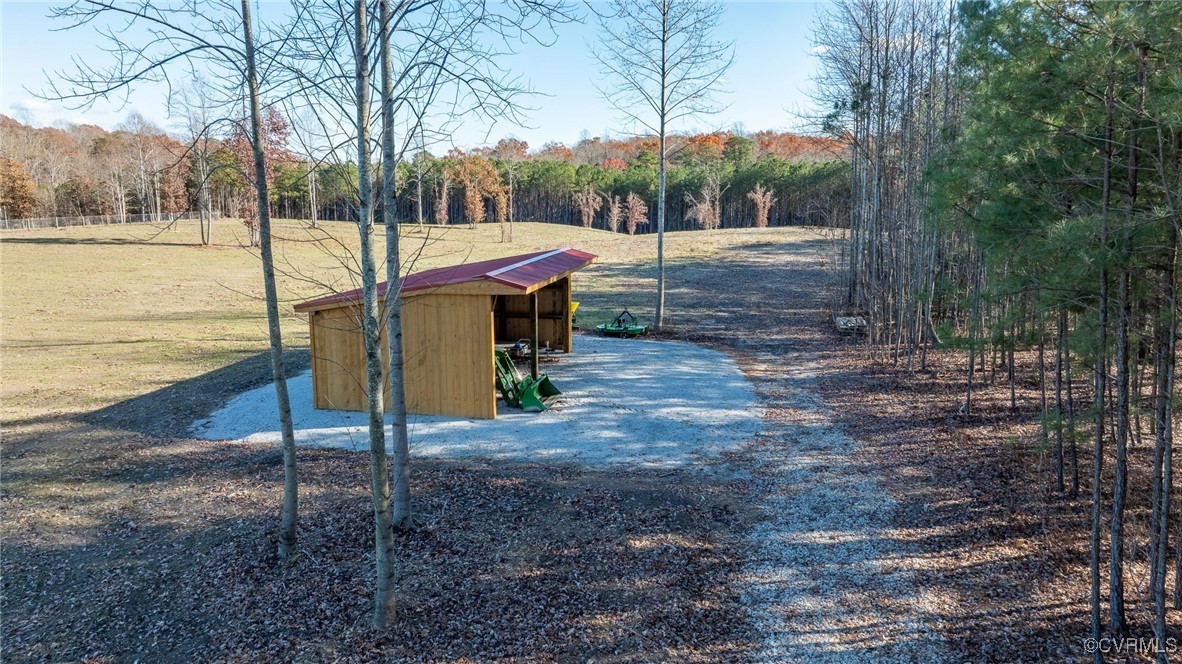 9950 Fire Tower Road Toano, VA 23168 - Photo 8 of 14 View of community featuring a lawn, a rural view,