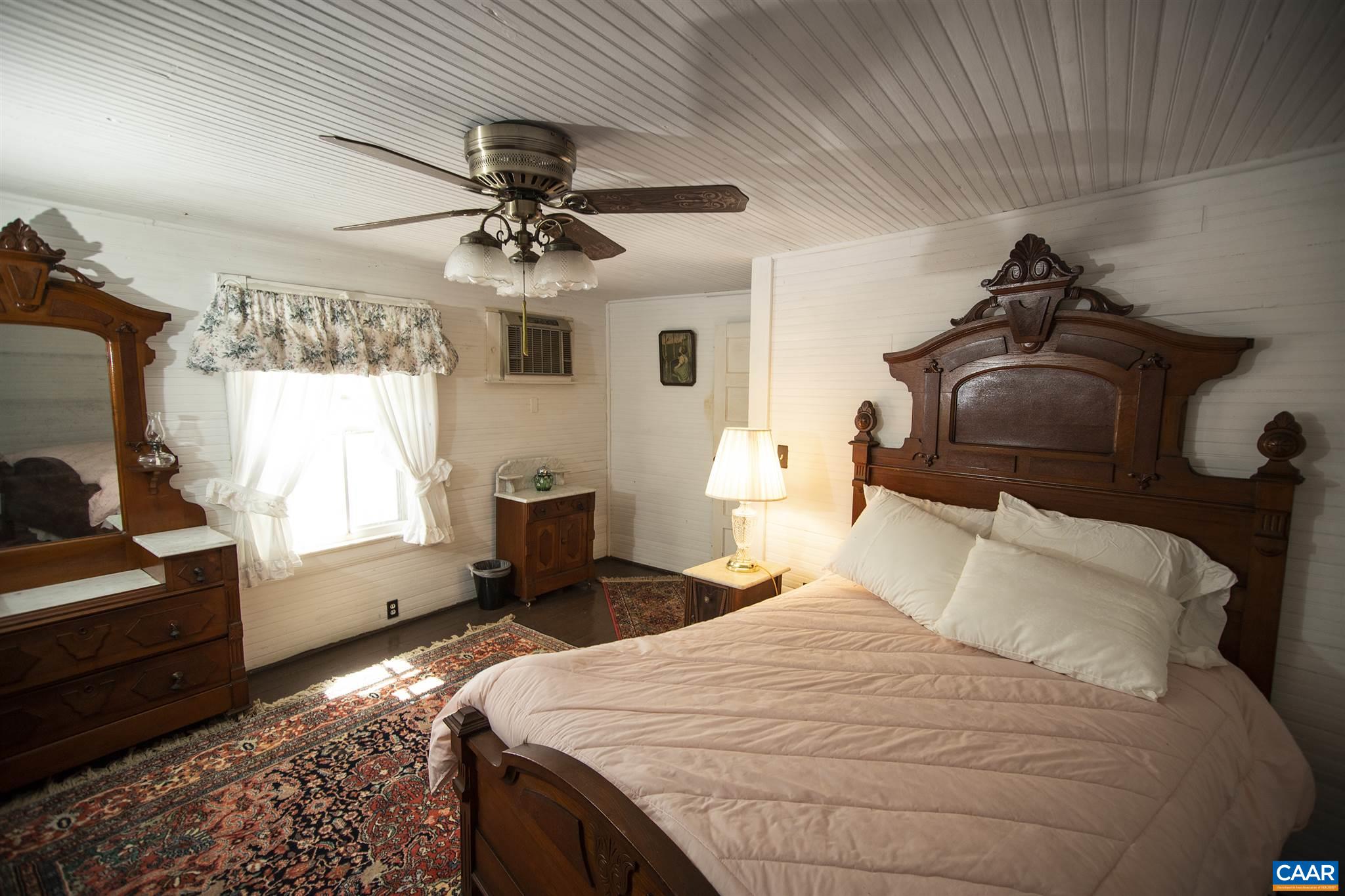 145 Turkey Way Amherst, VA 24521 - Photo 21 of 39 a bedroom with bed and window