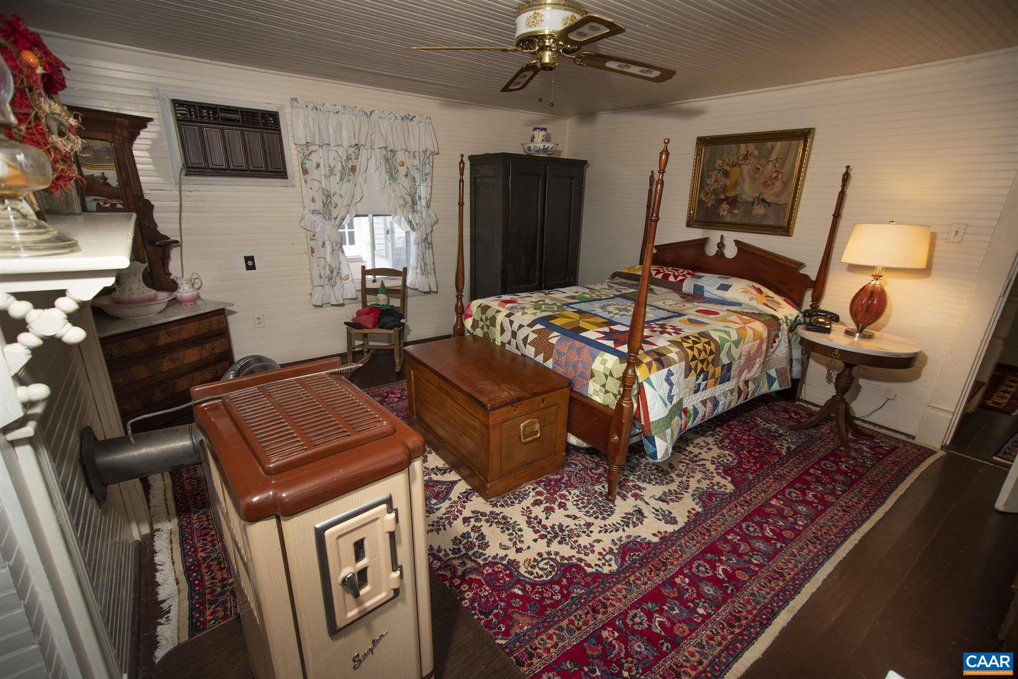 145 Turkey Way Amherst, VA 24521 - Photo 22 of 39 a bedroom with bed and wooden floor