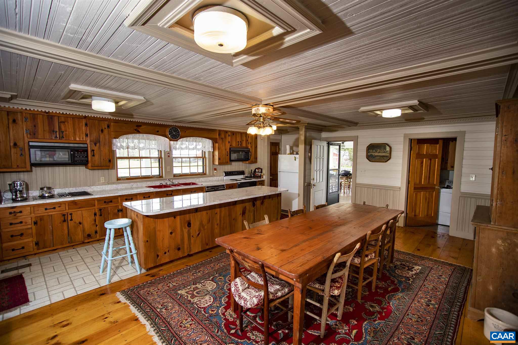 145 Turkey Way Amherst, VA 24521 - Photo 6 of 39 a kitchen with stainless steel appliances granite countertop a stove a sink dishwasher and cabinets with wooden floor