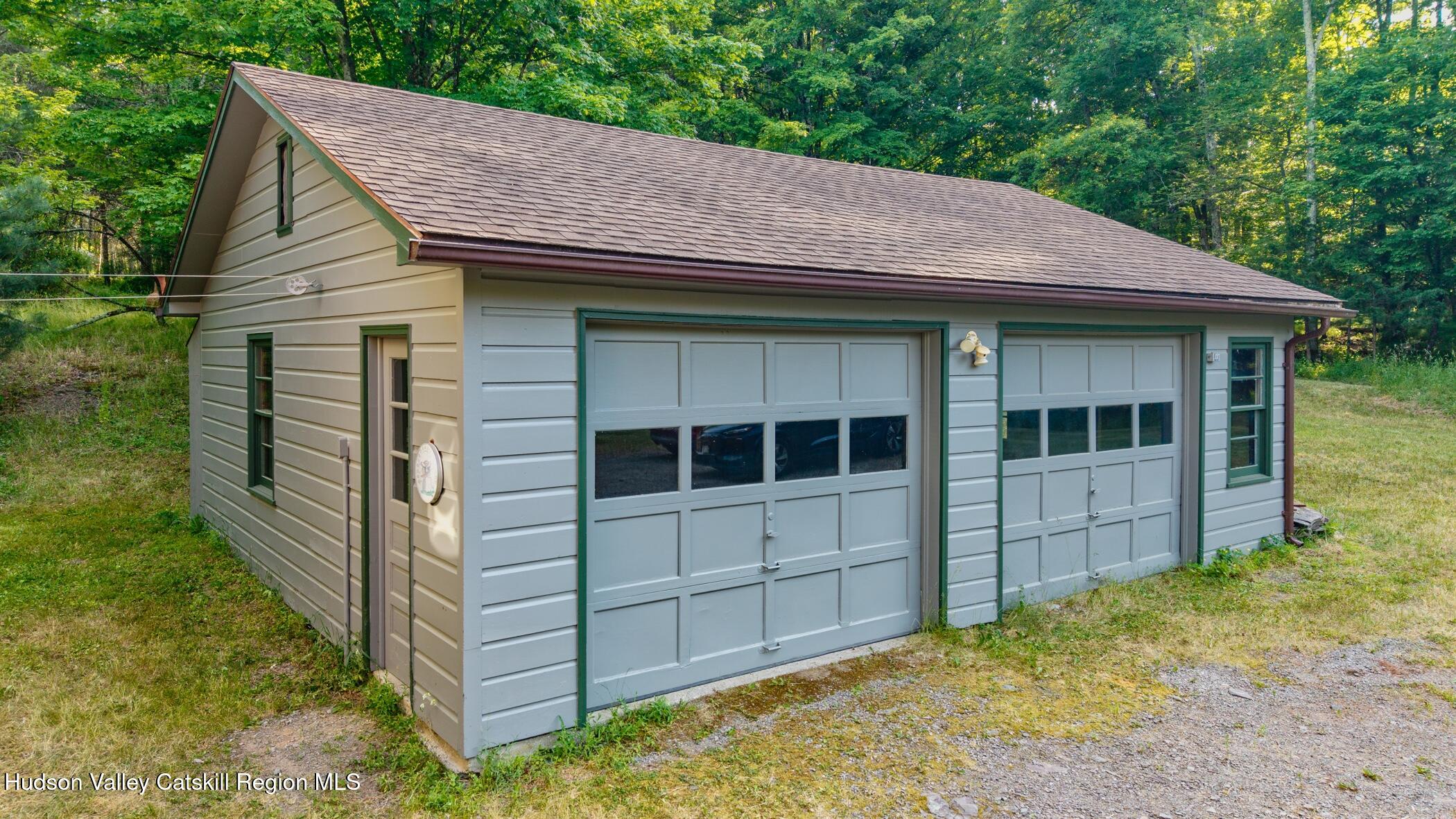 4533 Atwood Road Stone Ridge, NY 12484 - Photo 50 of 63 a house with white door of outdoor space