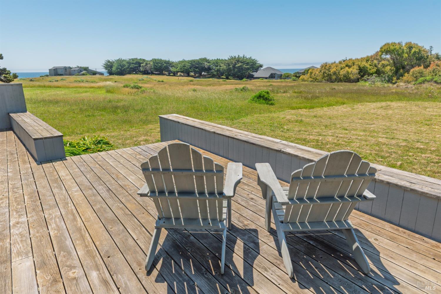 267 Sea Stack The Sea Ranch, CA 95497 - Photo 4 of 35 a view of a balcony with wooden floor and lake view