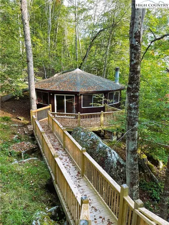 a balcony with wooden floor and outdoor space