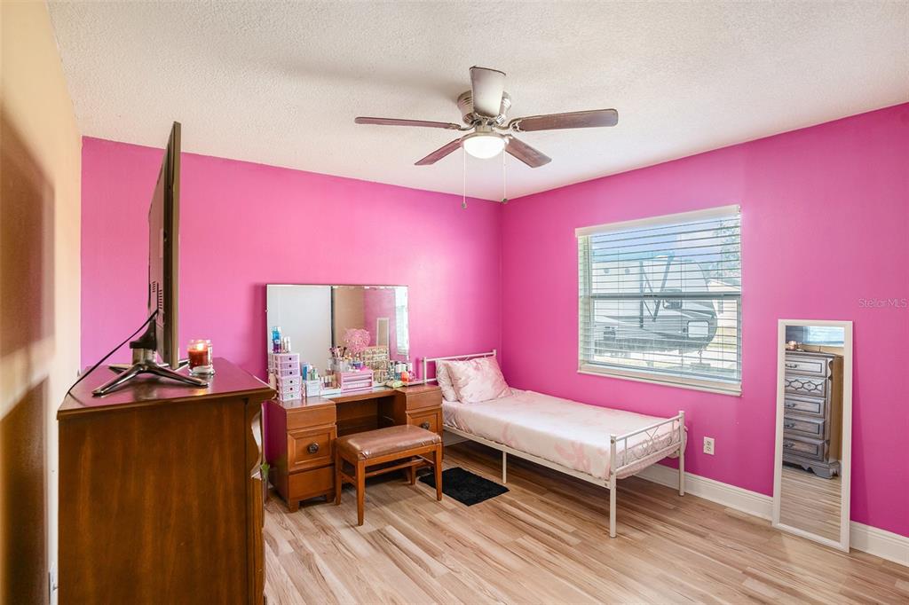 909 Silver Ridge Way Valrico, FL 33594 - Photo 10 of 15 a living room with furniture a rug and a window