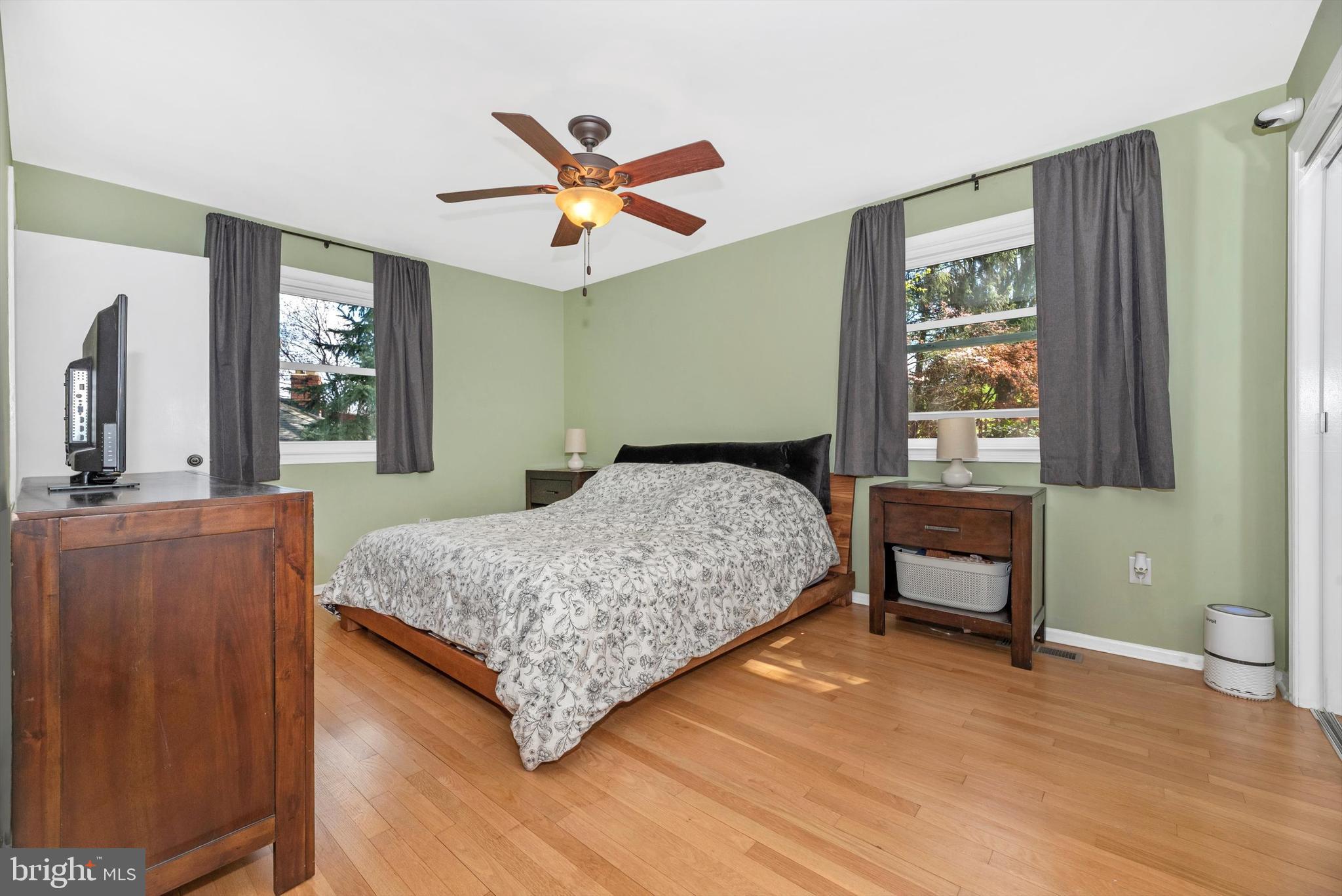 19605 Charline Manor Road Olney, MD 20832 - Photo 14 of 54 a bedroom with a bed and a chandelier