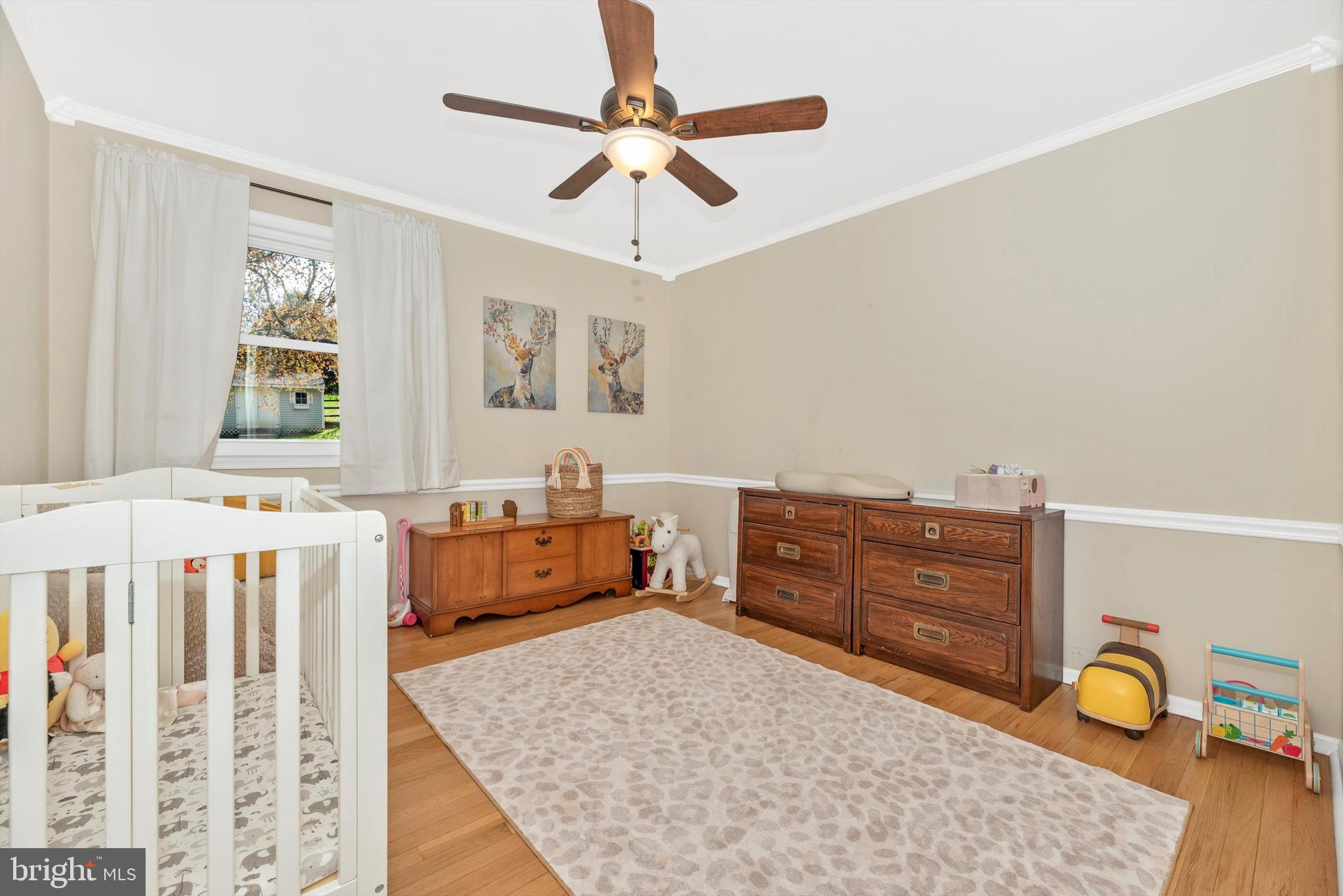 19605 Charline Manor Road Olney, MD 20832 - Photo 19 of 54 a bedroom with a bed and a dresser