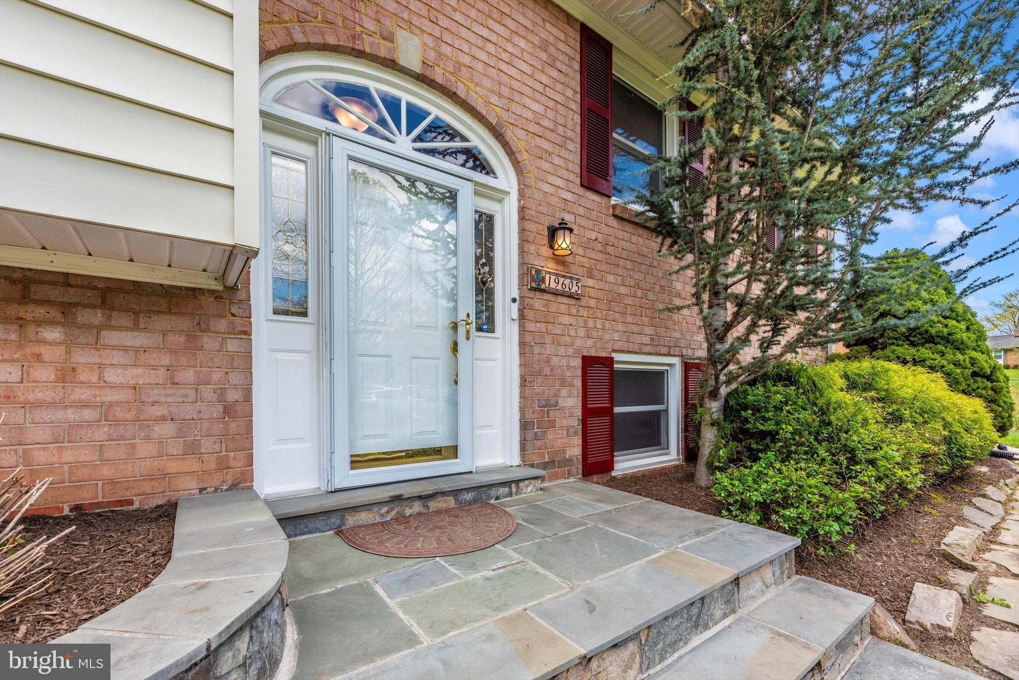19605 Charline Manor Road Olney, MD 20832 - Photo 2 of 54 a front view of a house with yard