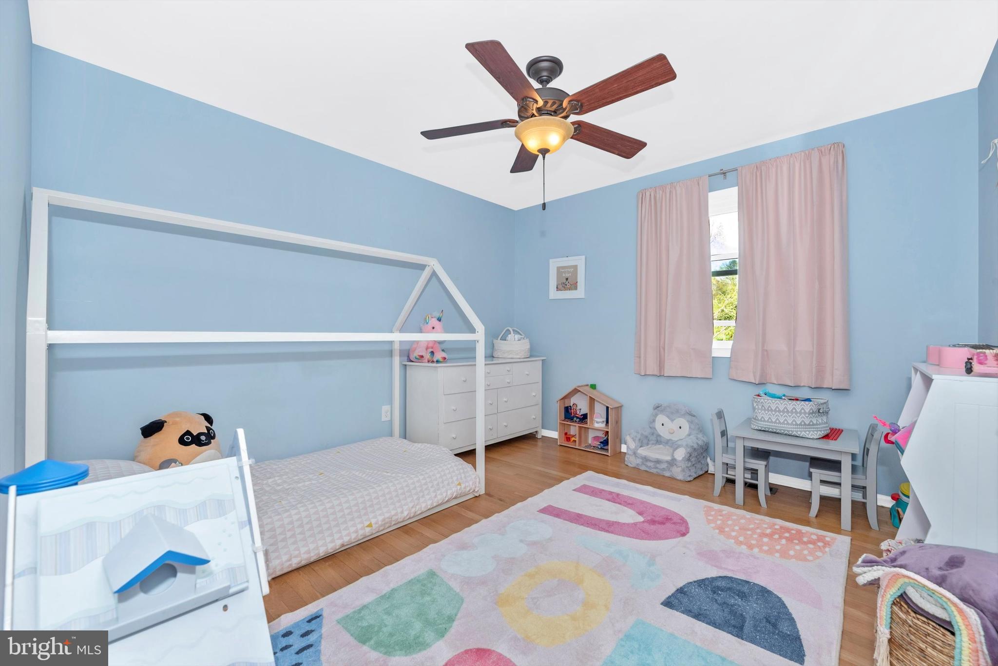 19605 Charline Manor Road Olney, MD 20832 - Photo 22 of 54 a bedroom with a bed and window