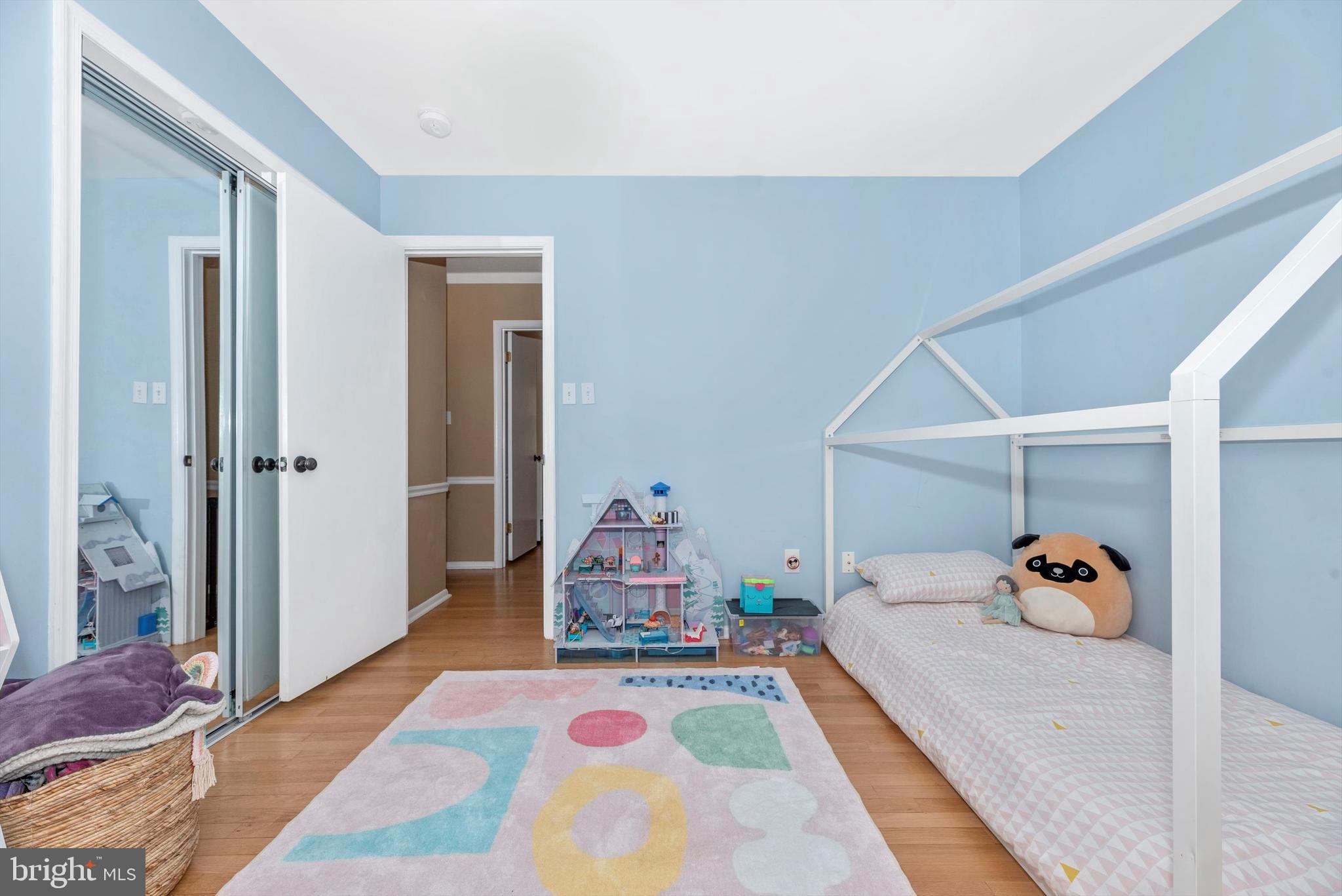 19605 Charline Manor Road Olney, MD 20832 - Photo 23 of 54 a bedroom with a bed and wooden floor