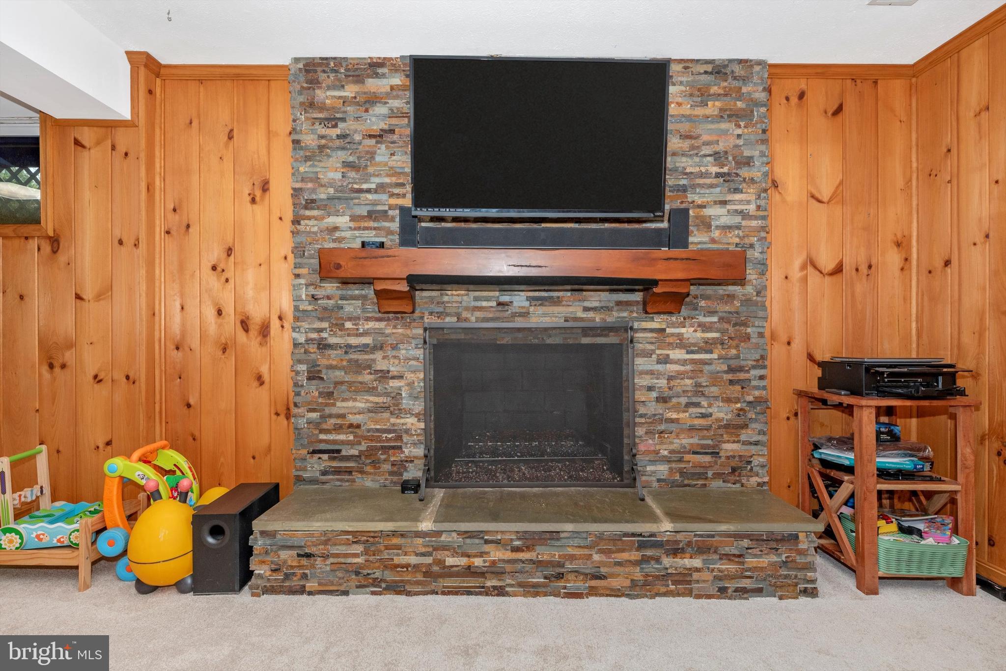 19605 Charline Manor Road Olney, MD 20832 - Photo 25 of 54 a living room with a fireplace furniture and a flat screen tv