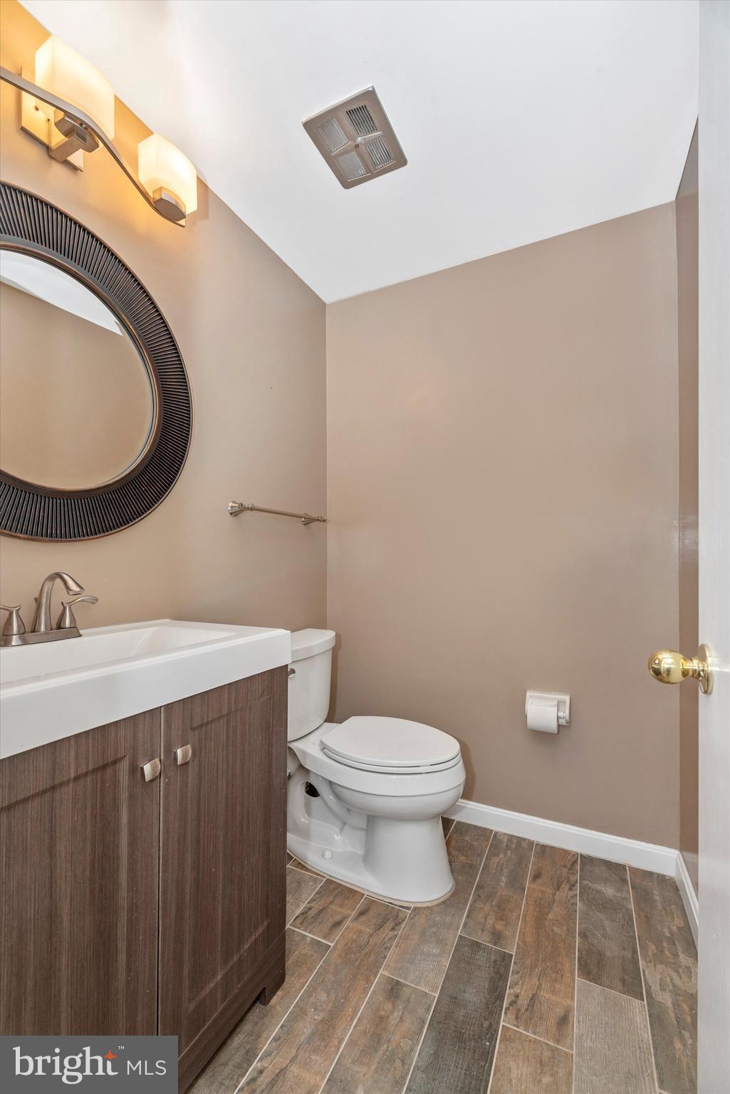 19605 Charline Manor Road Olney, MD 20832 - Photo 27 of 54 a bathroom with a toilet and a mirror