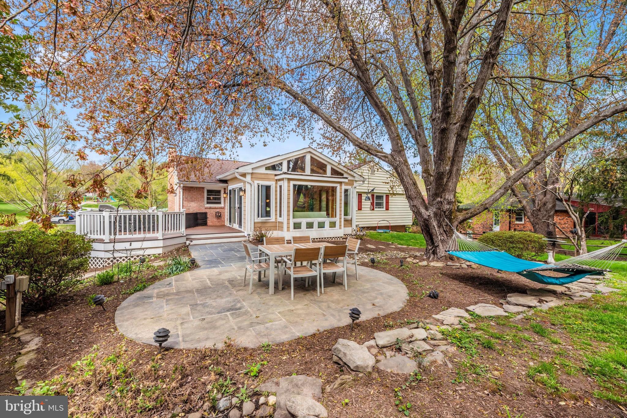 19605 Charline Manor Road Olney, MD 20832 - Photo 32 of 54 a view of a house with backyard and sitting area