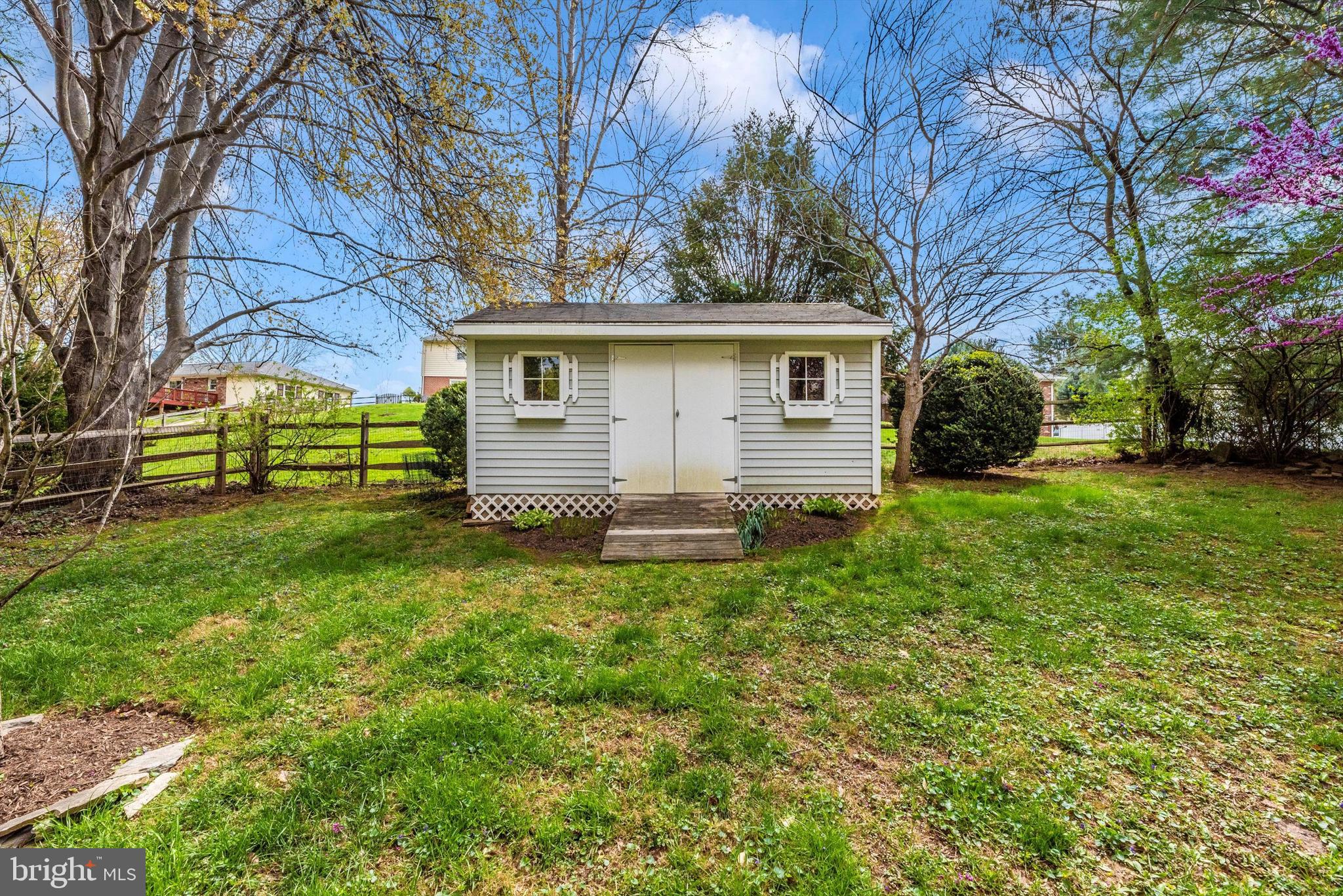 19605 Charline Manor Road Olney, MD 20832 - Photo 33 of 54 a view of a house with a yard