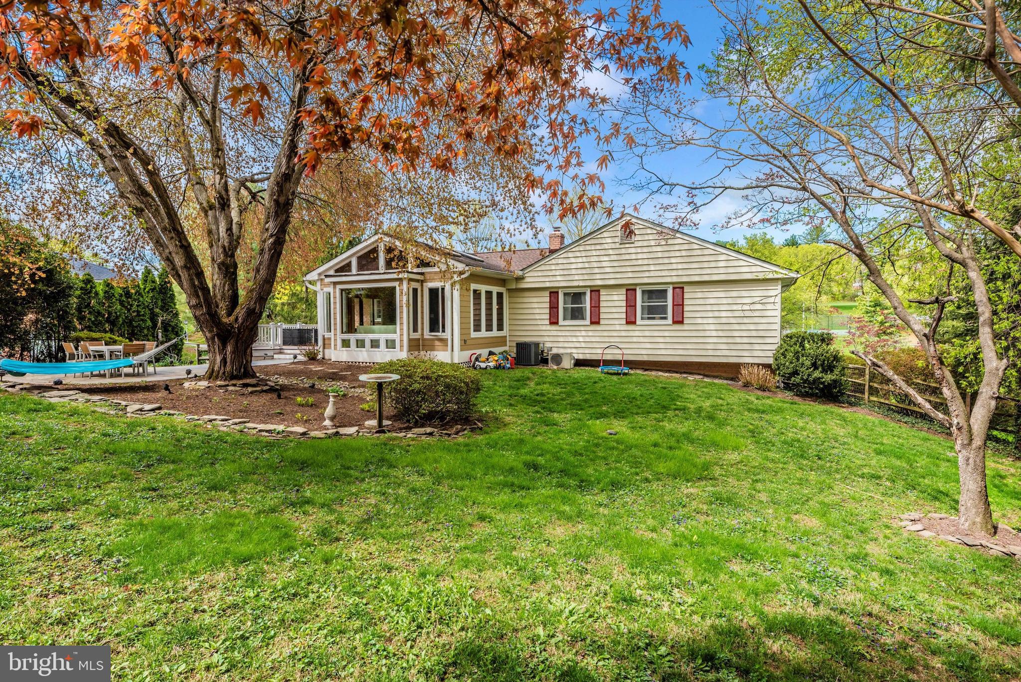 19605 Charline Manor Road Olney, MD 20832 - Photo 34 of 54 a front view of a house with a yard and trees